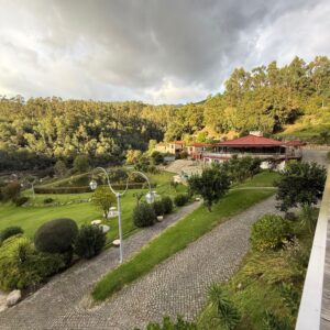 Garden paths and lawns among the green hills